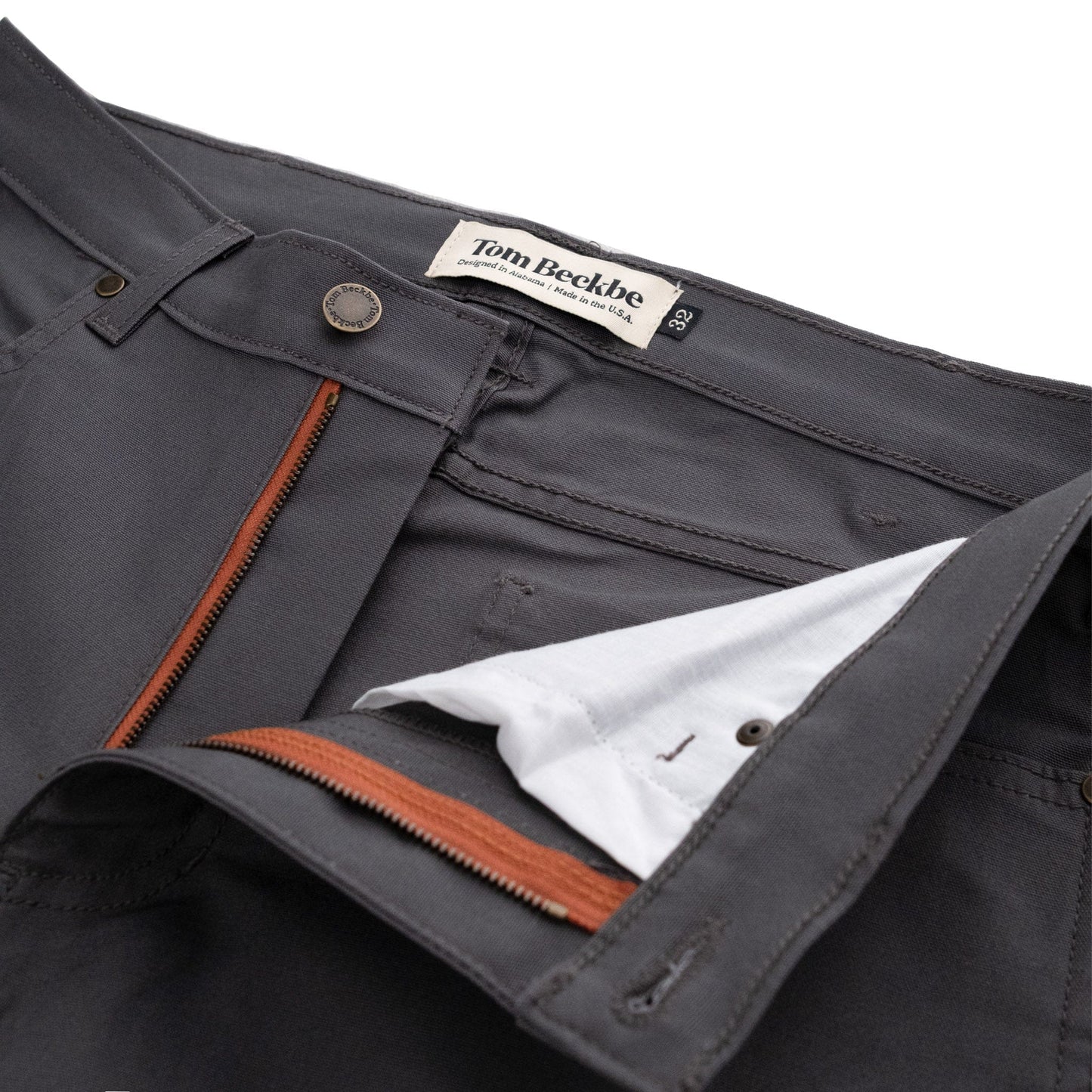Tom Beckbes Redmont Pant: gray, durable cotton, brass zipper, brown zip pocket & white waistband lining.