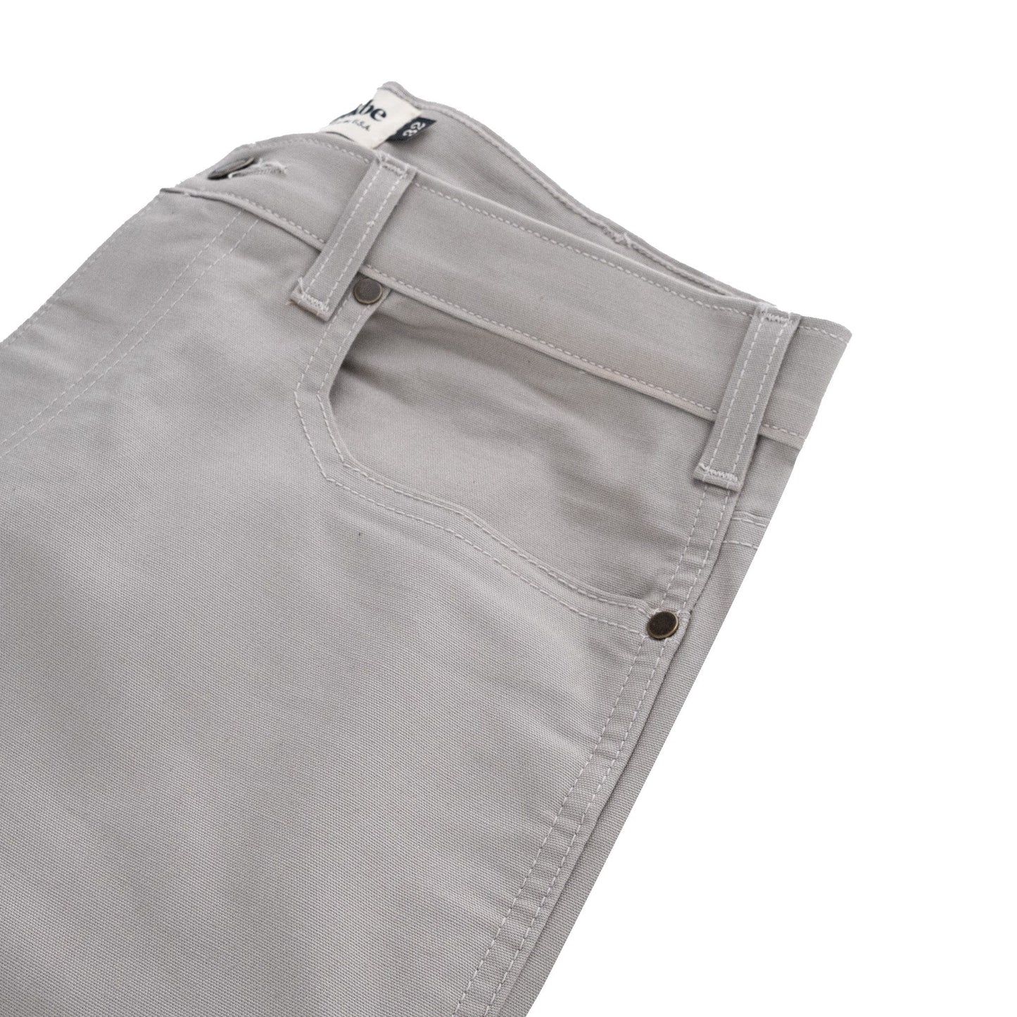 Tom Beckbes Redmont Pant in light gray, featuring durable cotton, front pocket, and belt loops on a white backdrop.