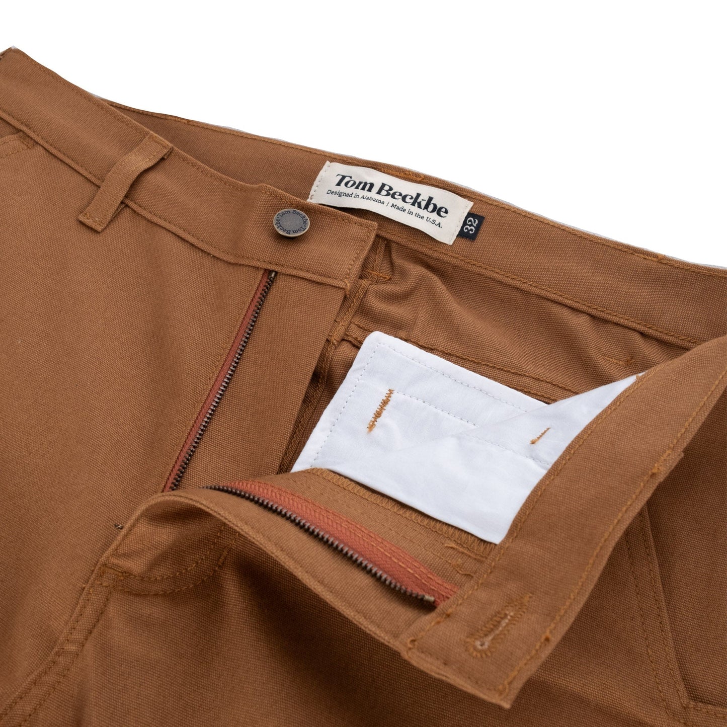 Brown Rutledge Double-Front Pant by Tom Beckbe features a zipper fly, button closure, and white pocket lining.