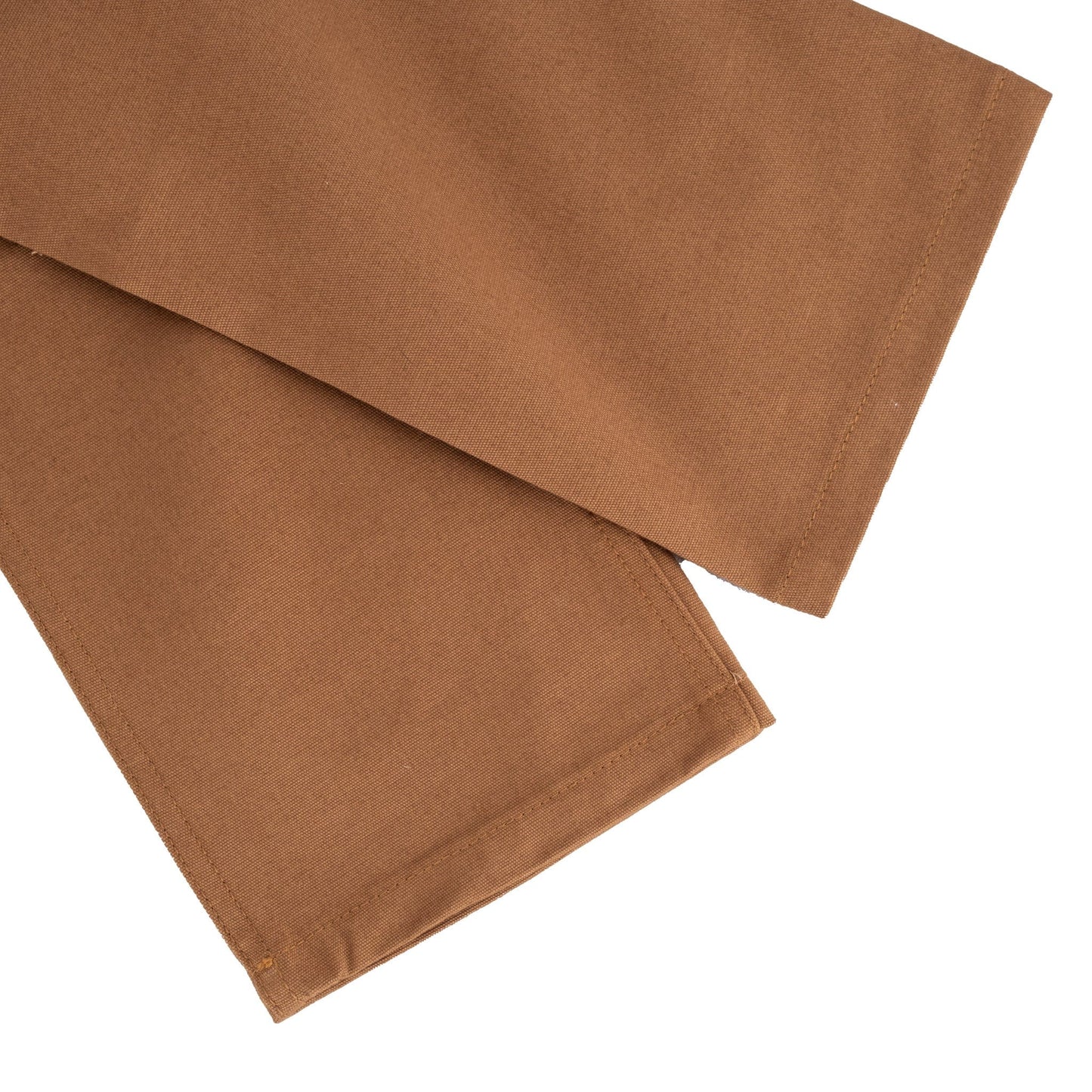 Close-up of the brown cotton Rutledge Double-Front Pant by Tom Beckbe, hem overlapping on a white background.