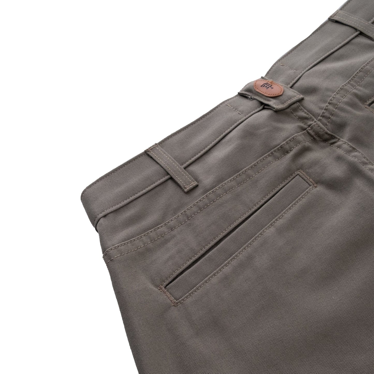 Close-up of Tom Beckbes Rutledge Double-Front Pant with classic fit, waistband, button, and pocket on white background.
