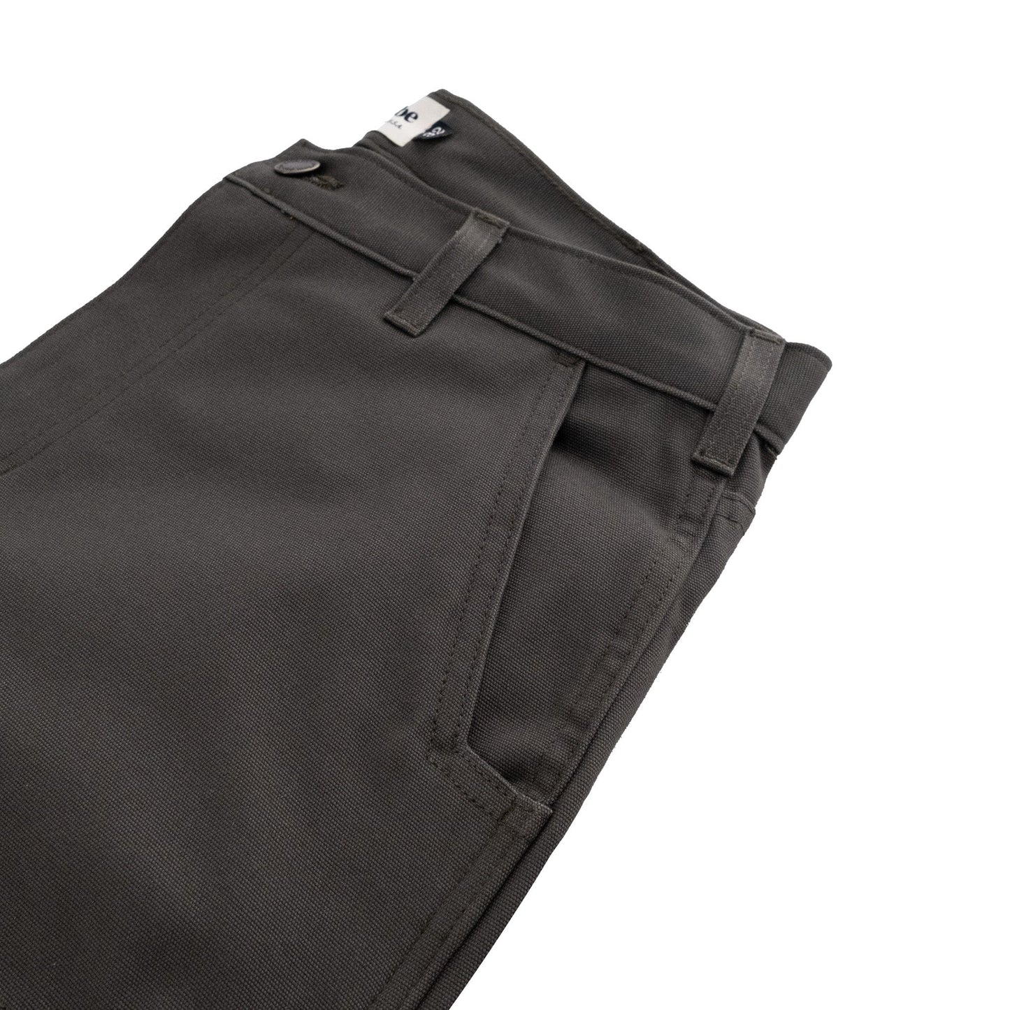 Tom Beckbes Rutledge Double-Front Pant in dark gray, classic fit, folded at thigh with belt loops and visible tag.