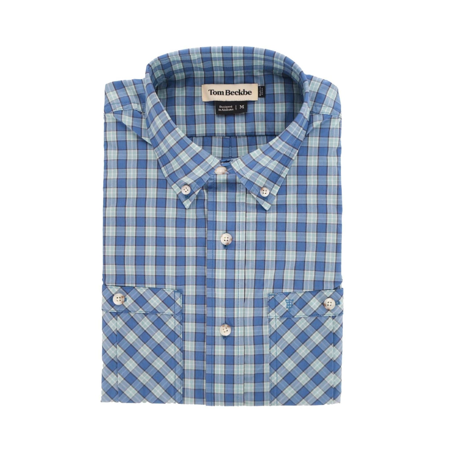 The Tidewater Shirt by Tom Beckbe, in blue plaid, offers UPF 30+ protection for lightweight outdoor adventures.