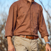Man wearing a Tom Beckbe Dixon Brushed Cotton Twill Shirt, khaki pants, brown belt, and watch, outdoors from chest to waist.