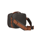 Side view of a fishing hip pack that features two antique brass d-rings for fishing gear attachments.