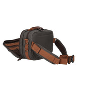 Fishing hip pack with the front pocket open 75 degrees, which secures tools and fishing essentials.
