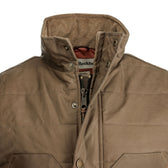 Close-up of Tom Beckbe Fowler Vest: brown, quilted, HD Wool insulation, high collar, zipper & snap button front.