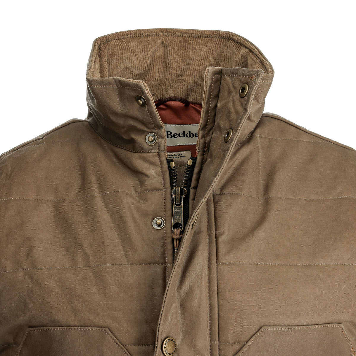Close-up of Tom Beckbe Fowler Vest: brown, quilted, HD Wool insulation, high collar, zipper & snap button front.