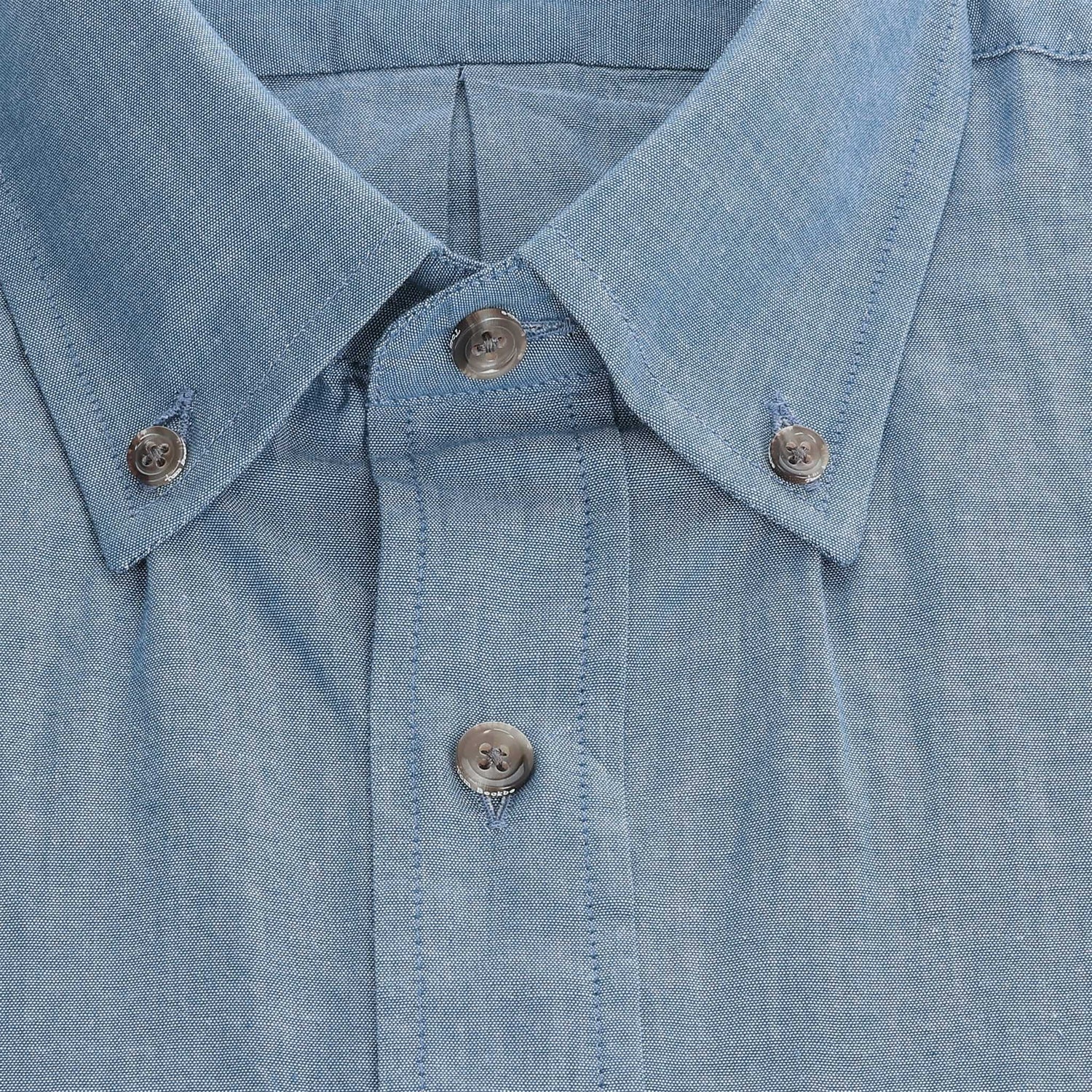 Close-up of the Hanover Chambray Shirt collar and placket with three buttons, by Tom Beckbe.
