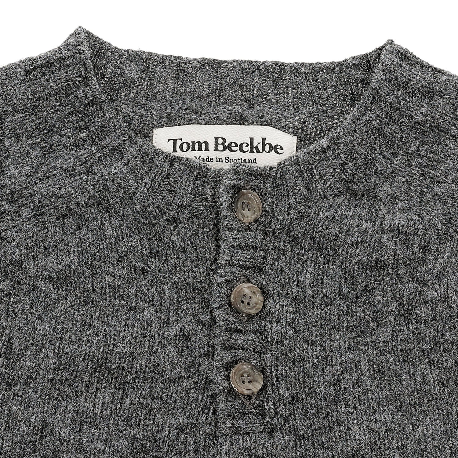 Close-up of Tom Beckbe Albemarle Henley Sweater, gray wool with three buttons, made in Scotland.