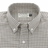 A close-up of a plaid button-down shirt with a Tom Beckbe Ducks Unlimited label inside the collar.