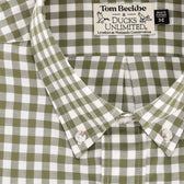 Close-up of a green and white checkered button-down shirt with Tom Beckbe & Ducks Unlimited label visible.