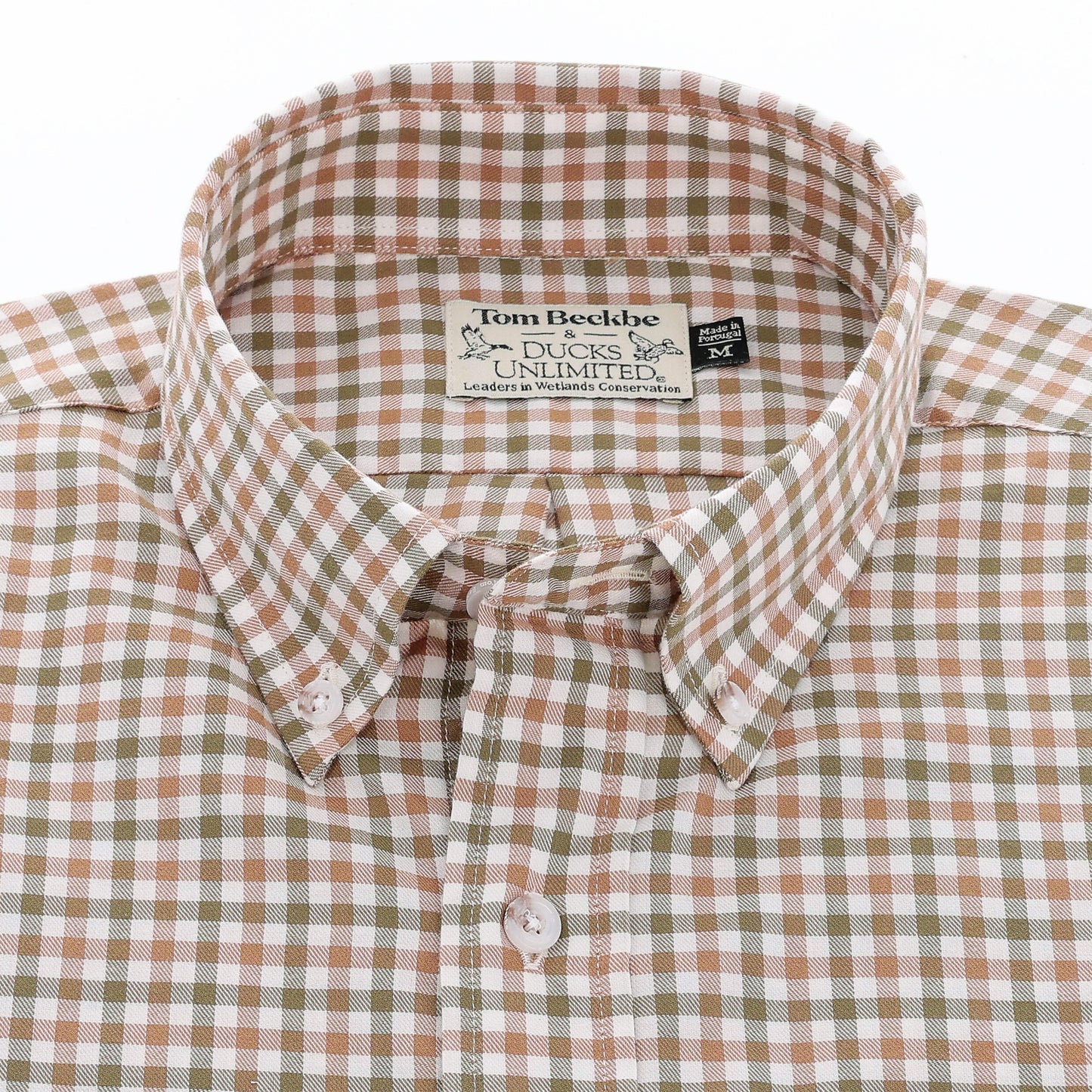 A brown and white plaid Knapp Cotton Twill Shirt by Tom Beckbe with a visible collar label.