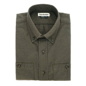 A folded olive green Dixon Brushed Cotton Twill Shirt by Tom Beckbe with button collar and cuffs, labeled inside.