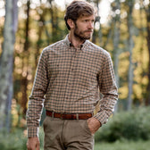 Man outdoors wearing Tom Beckbe Dixon Brushed Cotton Twill Shirt and khaki pants, trees blurred in background.