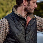 A man in the Tom Beckbe Dixon Brushed Cotton Twill Shirt stands outdoors by a white vehicle, looking to the side.