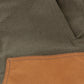 Close-up of Tom Beckbe Burwell Brush Pant in brown waxed canvas with a stitched tan pocket on the lower left side.