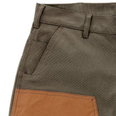 Close-up of Tom Beckbe’s Burwell Brush Pant in khaki with brown reinforced patch, front pocket, and sturdy belt loops.
