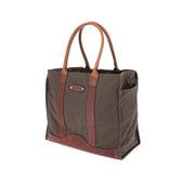 The Tom Beckbe Canvas Carryall Bag features brown leather handles and trim, displayed on a white background.