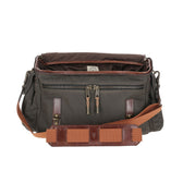 The Tom Beckbe Canvas Field Bag is rugged, and waxed in green and brown cotton with pockets and an adjustable strap.