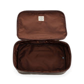 Tom Beckbes Canvas Packing Cube: Open rectangular brown bag with plain interior and white tag for travel needs.