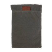 Tom Beckbes Canvas Portfolio: a weatherproof sleeve with leather accents, ideal for tablets or laptops.