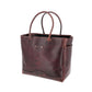 Brown leather tote bag on a white background