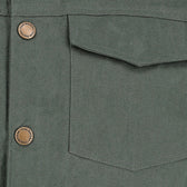 Close-up of the Tom Beckbe Crawford Jacket shows a chest pocket and two metal buttons with engraved text.