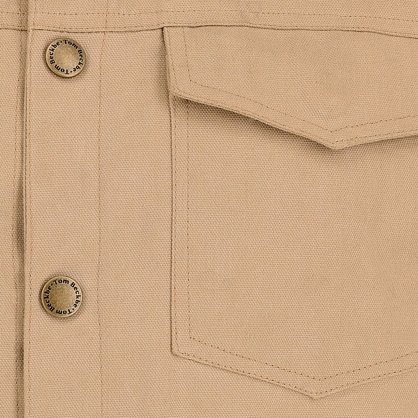 Close-up of the Tom Beckbe Crawford Jacket in beige with a pocket, visible stitching, and metal buttons.