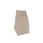 Tom Beckbes Crenshaw Performance Shorts are beige, knee-length, with four-way stretch, elastic waistband, and a back pocket.