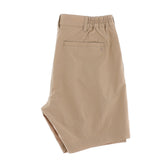 Tan khaki Tom Beckbe Crenshaw Performance Short with elastic waistband and back pocket, on a white background.