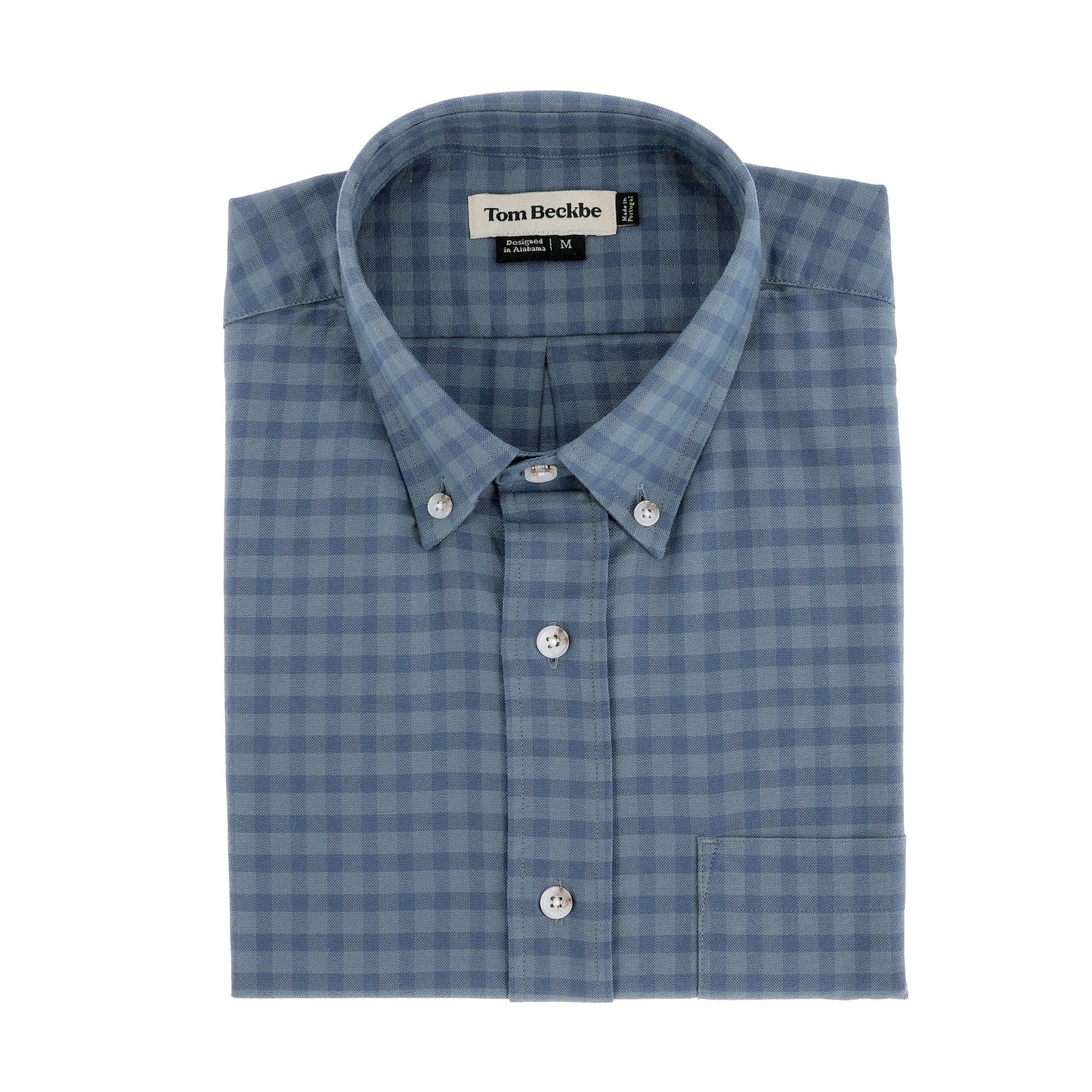 Folded Tom Beckbe Culver Oxford Shirt in Lake Blue with front pocket, shown against a white background.