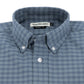 The Culver Oxford Shirt by Tom Beckbe is a blue and gray checkered button-down with a branded label inside the collar.