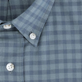 Close-up of the Culver Oxford Shirt by Tom Beckbe, featuring a blue and gray check pattern and white buttons.