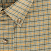 Close-up of the Culver Oxford Shirt by Tom Beckbe—a buttoned collar with green and orange plaid pattern.