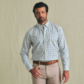 Man wearing the Tom Beckbe Ensley Pinpoint Oxford Shirt with beige pants and a brown belt, against a plain background.