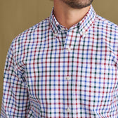 Model wears Tom Beckbe Ensley Pinpoint Oxford Shirt, multicolor check, chest to chin view with pocket visible.