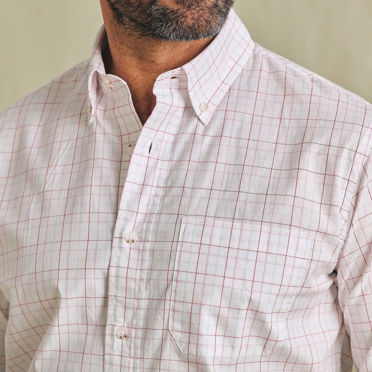 A man wearing the Tom Beckbe Ensley Pinpoint Oxford Shirt with a chest pocket.