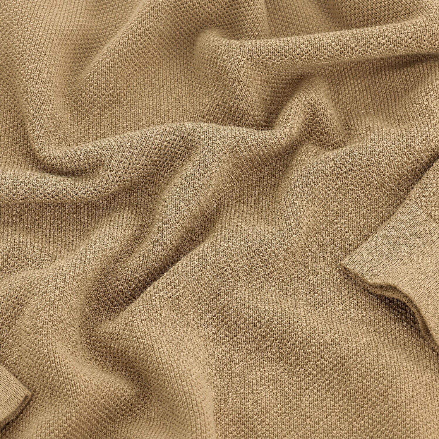 Tom Beckbe Foley Pima Crewneck Sweater in beige knit with textured pattern, folds, and ribbed cuffs.