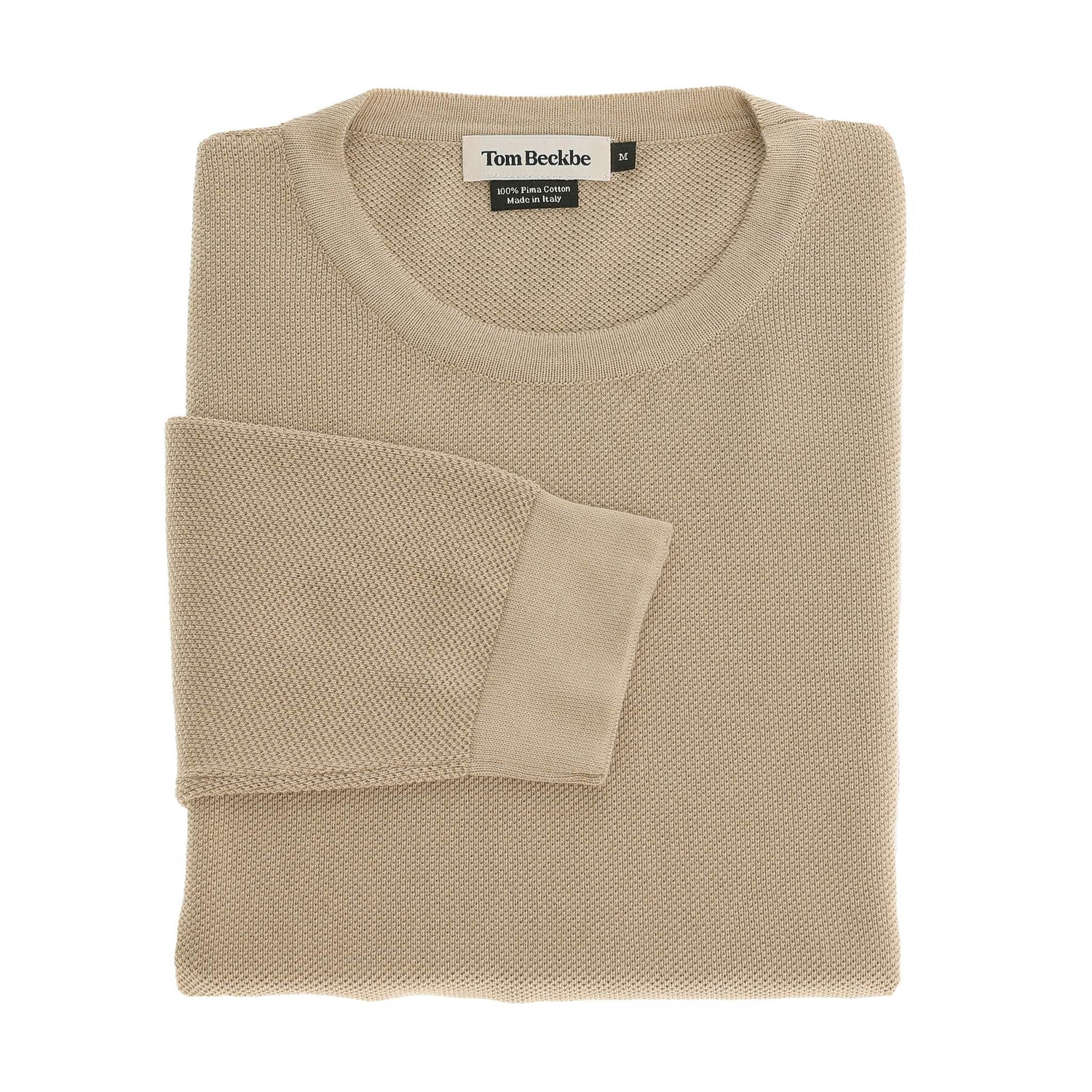A folded beige Tom Beckbe Foley Pima Crewneck Sweater with the label visible at the neckline.