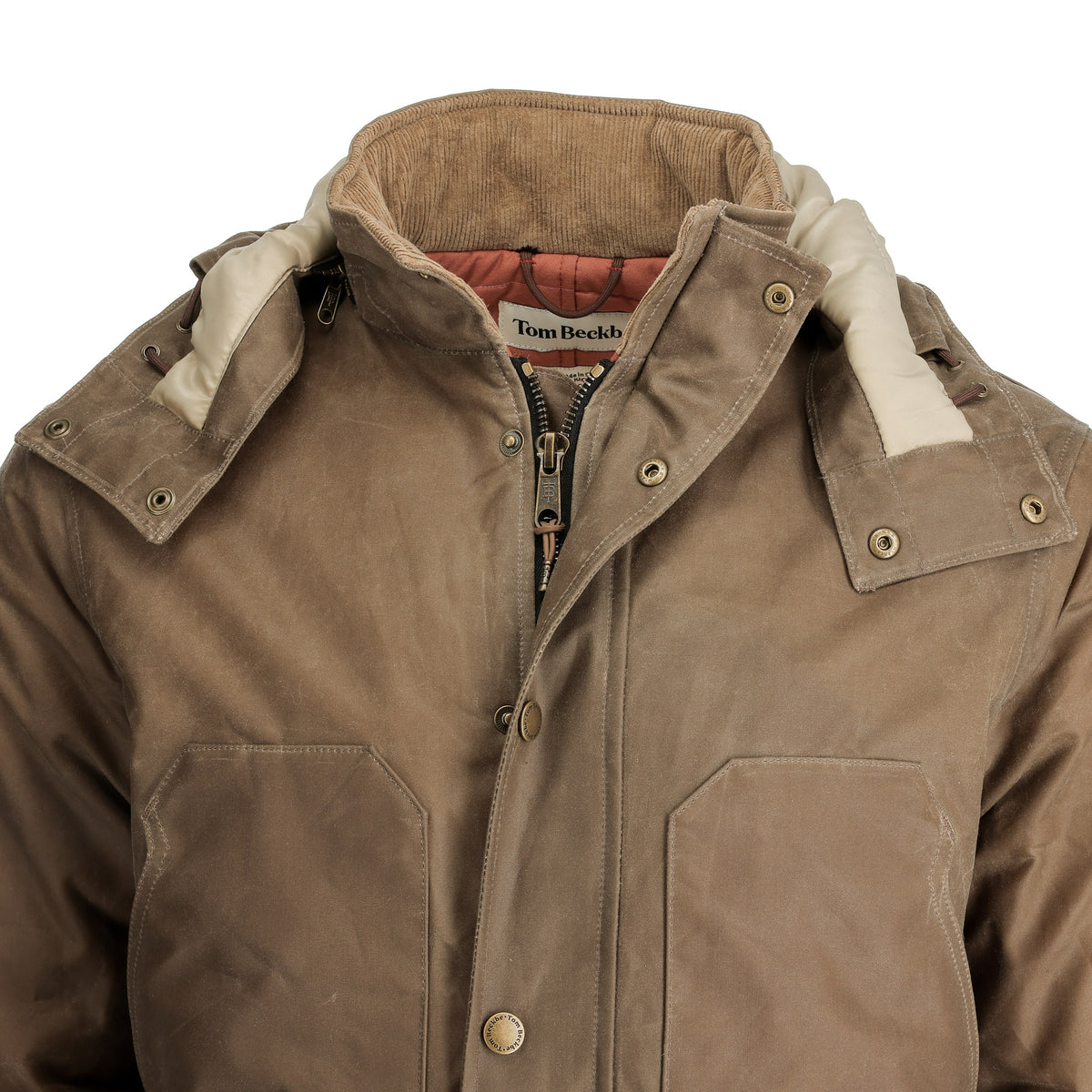 Brown waxed cotton Tom Beckbe Fowler Jacket with chest pockets, beige hood lining, and zip-button closure.