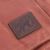 Tom Beckbes Fox Red Tensaw Jacket features a brown fabric leather patch embossed with Wildrose Kennels dog holding a bottle.