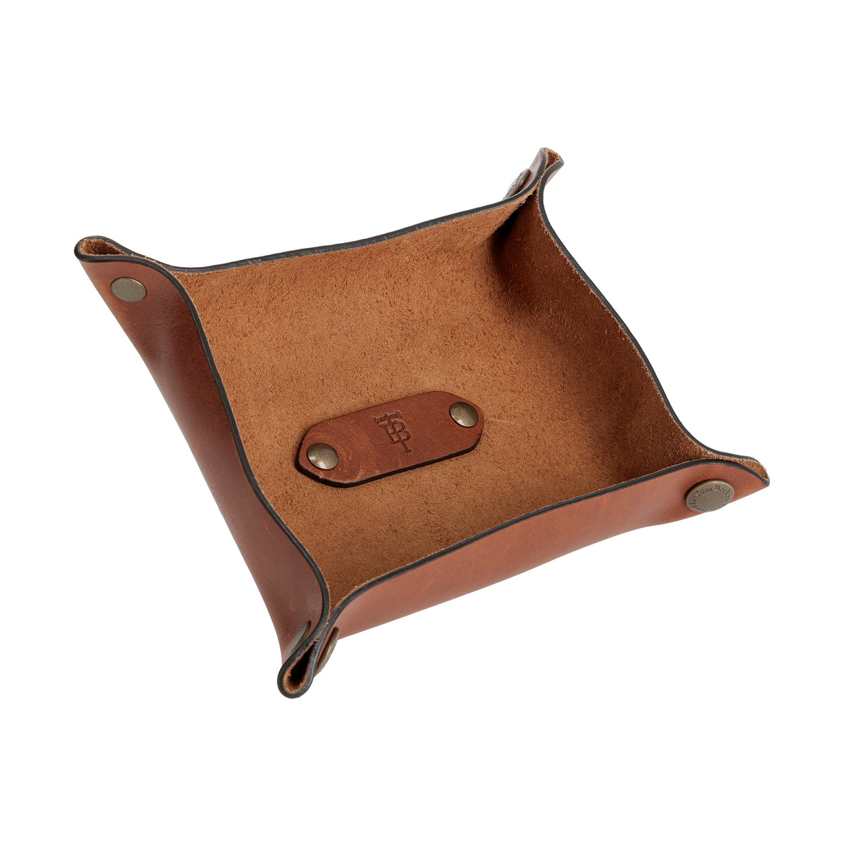 Tom Beckbe Leather Change Tray in chestnut with metal corner snaps, shown from above at an angle.