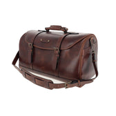 Tom Beckbe Leather Weekender Duffel Bag with shoulder strap and handles, shown on a white background.