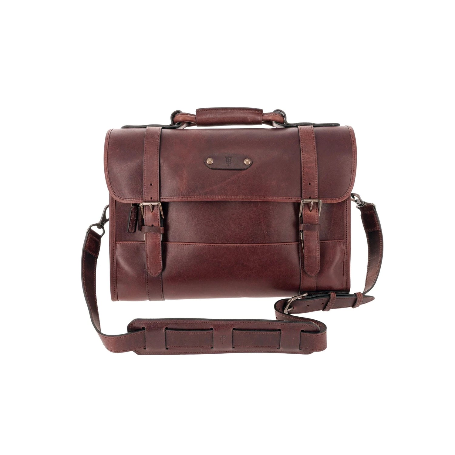 Brown leather satchel with a top handle, front buckle straps, and an adjustable shoulder strap against a white background.