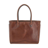 The Palmer Leather Tote by Tom Beckbe is a compact full-grain leather bag with two handles and a smooth finish.