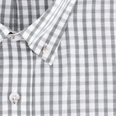 Close-up of the Monroe Poplin Shirt by Tom Beckbe—gray and white checkered cotton with white buttons and classic collar.