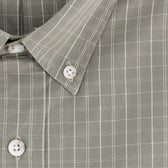 Close-up of the Monroe Poplin Shirt by Tom Beckbe—a green plaid, breathable cotton shirt with collar and white buttons.