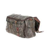 Tom Beckbes Canvas Field Bag features Mossy Oak Original Bottomland camo, multiple zippers, and side clasps.