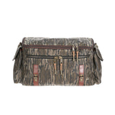 Tom Beckbes Canvas Field Bag in Mossy Oak Original Bottomland has zipper closures, multiple pockets, and brown leather accents.